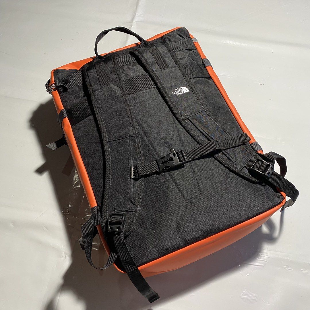 The North Face Base Camp Duffel Backpack Orange (Category: Backpacks) located in Manila. Submitted by ashiee111 (Listing ID 1455837841, Image 3). Description: - Authentic Orange The North Face backpack - Distinctive boxy shape with prominent front logo - Features multiple straps and buckles for adjustable and secure fit - Main compartment opens wide for easy packing and access - Includes a convenient mesh pocket inside for organization - Perfect 