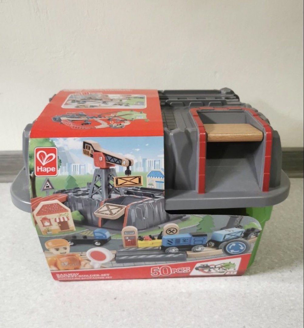 Train set (Category: Lego & Building Sets) located in Singapore. Submitted by ni84 (Listing ID 1455723937, Image 7). Description: 48 psc instead of 50 psc missing two small items. One of the stand has a broken hinge. Hence giving 2 compatible trains. Hape train set.