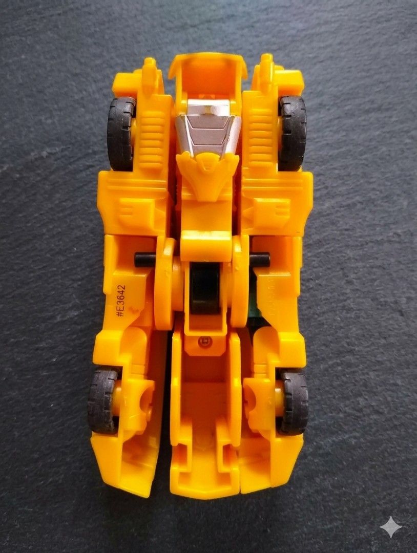 Transformers Bumblebee Car Toy (Category: Vehicle & Diecast Models) located in Pasig City. Submitted by kat_grande (Listing ID 1455717264, Image 2). Description: - Yellow Transformers Bumblebee toy car - Features Autobot logo on the front - Approximately 10cm in length - Transforms into robot mode - Ideal collectible for any Transformers fan.