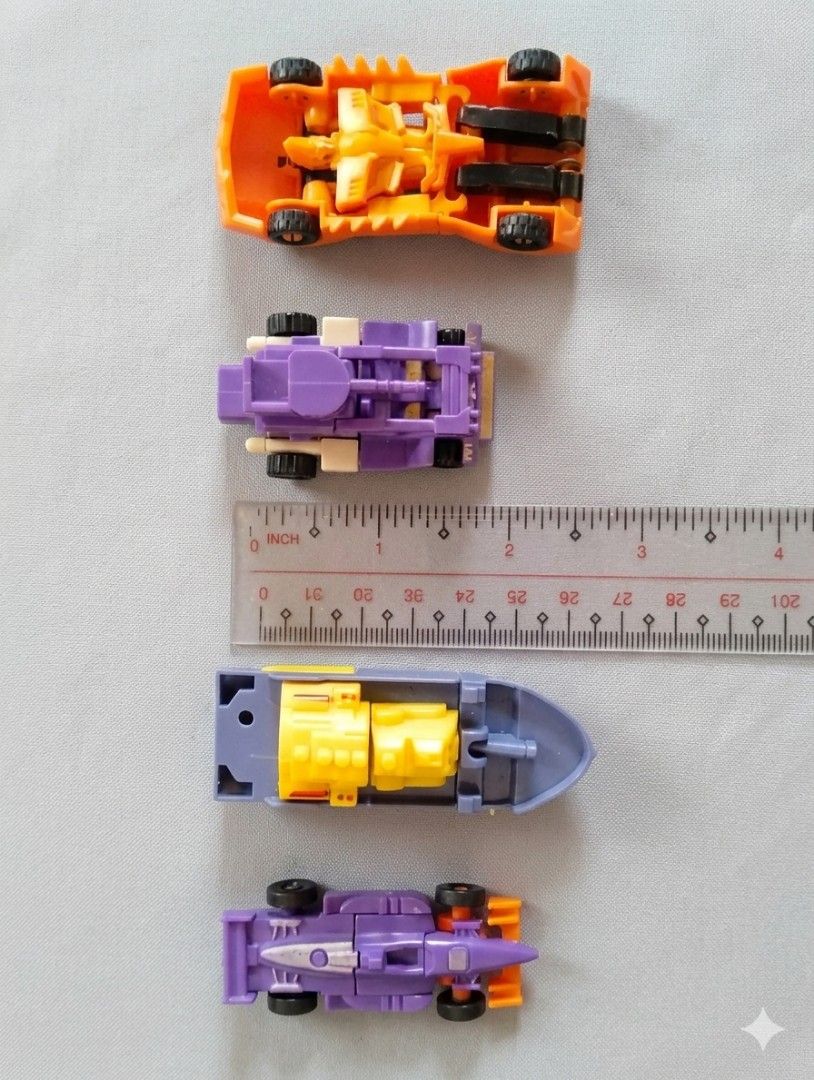 Transformers Mini-Con Robots Lot - Cars & Boat (Category: Vehicle & Diecast Models) located in Pasig City. Submitted by kat_grande (Listing ID 1455731910, Image 2). Description: - Lot of 4 mini Transformers robots - Includes: 2 purple race cars, 1 blue and yellow boat, 1 orange robot car - All robots transform into vehicles - Perfect for Transformers collectors or kids - All items included are pictured.