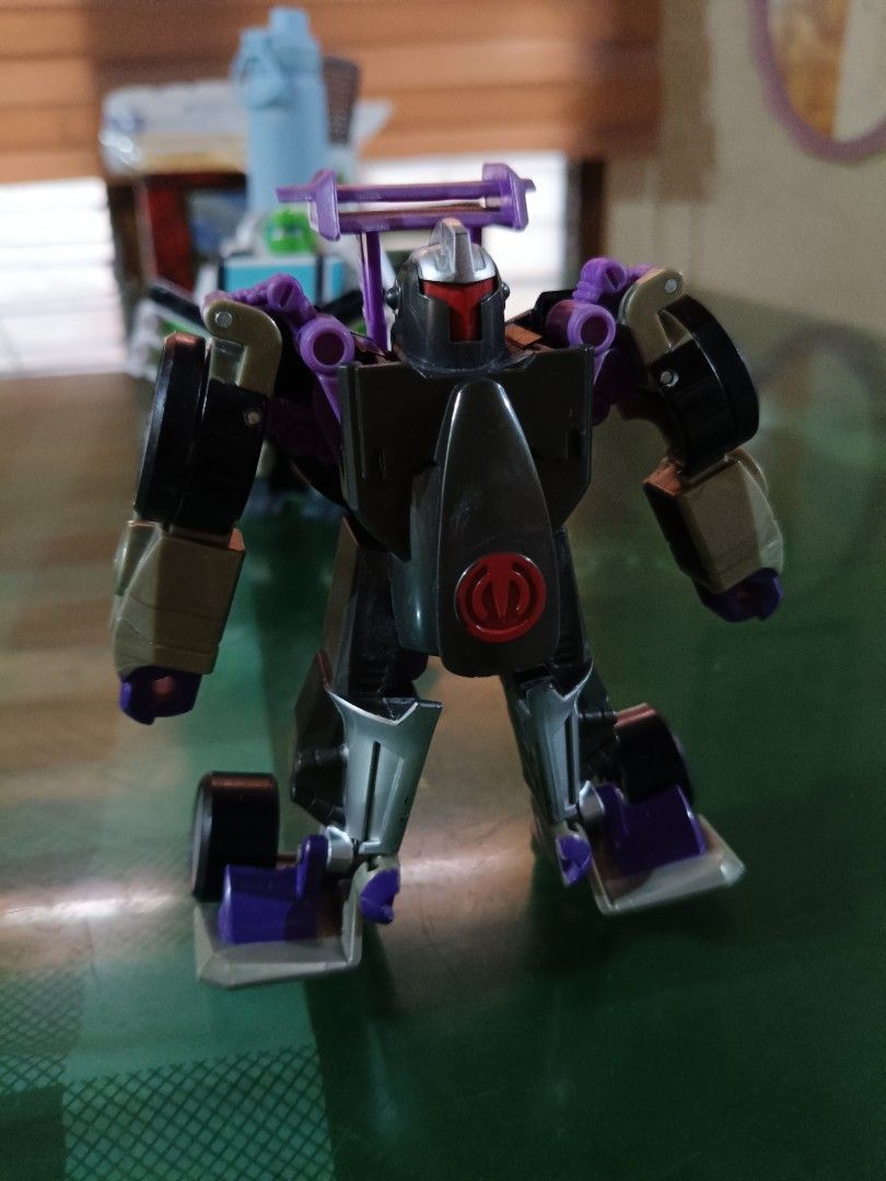 Transformers Robot Car Toy - Black and Purple (Category: Vehicle & Diecast Models) located in Angeles City. Submitted by mysticdeer-32c4 (Listing ID 1455730401, Image 2). Description: - Cool Transformer toy - Transforms from robot to car - Striking black and purple color scheme - Minor scuffs from previous play, adding character! - Ideal for any Transformers enthusiast - Ready to join a new collection!.