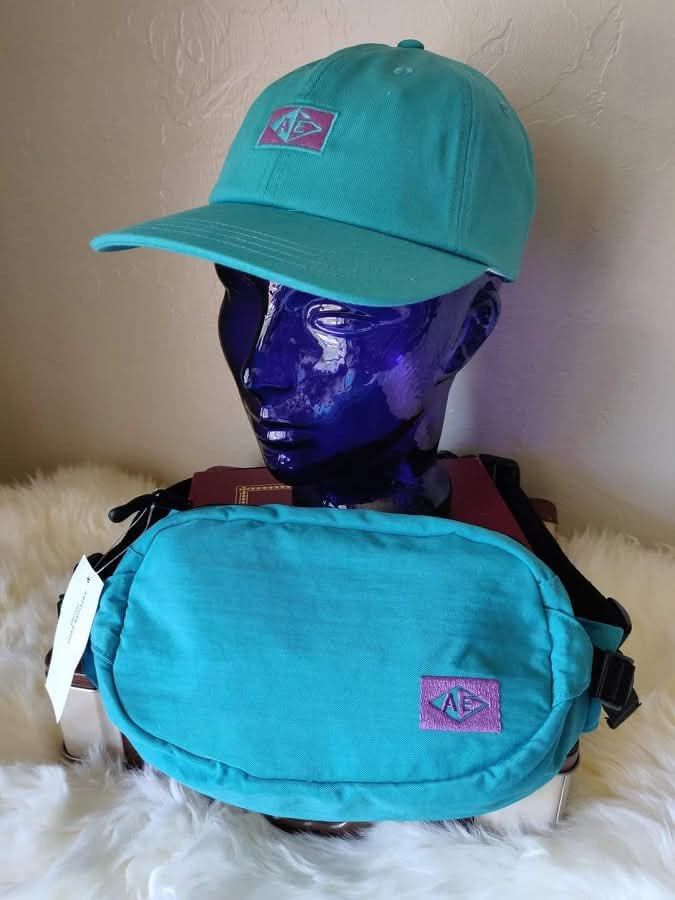 Unisex AE Teal Cap | Brand New (Category: Hats & Beanies) located in Quezon City. Submitted by ranielafinds (Listing ID 1455845316, Image 1). Description: Brand new and never worn. Classic baseball cap featuring the AE logo, perfect for everyday casual wear. 🧢 • Brand: American Eagle (AE) • Color: Teal • Style: Baseball Cap • Fit: Unisex • Condition: Brand New / Never Worn Available: Cap only Matching waist bag is SOLD.