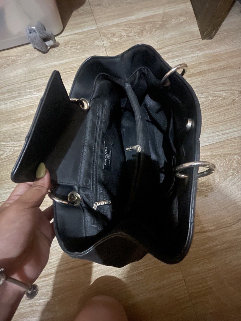 Vintage Chanel Bag (Category: Luxury Bags & Wallets) located in Trece Martires City. Submitted by justprelovedx (Listing ID 1455697719, Image 3). Description: - Vintage Chanel Shoulder Bag - Color: Black - Material: Genuine Leather - Iconic Quilted Design with CC Logo - Silver Chain Straps - Interior Compartments - Good Pre-loved Condition -No Code.