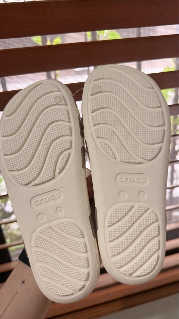White Crocs Jelly Sandals with Glitter - J1 (Category: Flats & Sandals) located in San Juan City. Submitted by klpw_ (Listing ID 1455751192, Image 2). Description: - Brand new Crocs Isabella Jelly Sandals - Size J1 - Cute glitter detail on straps - Perfect for beach days or casual wear - Comes with a green Crocs tote bag - Never worn, brand new with tag, still in original packaging.