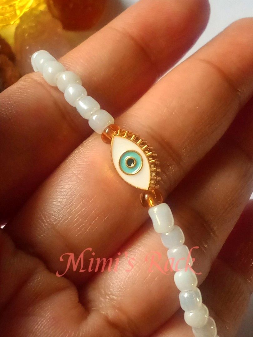 White Enamel Evil Eye Bracelet with White Seed Beads (Category: Bracelets) located in Taguig. Submitted by mimisrack (Listing ID 1455733388, Image 3). Description: 🤍A delicate and elegant bracelet featuring a white enamel evil eye charm, accented with tiny white seed beads for a clean and minimalist look. ✨ -The gold-tone details add a warm touch, while the classic evil eye design gives the bracelet a stylish and meaningful accent. Perfect for e
