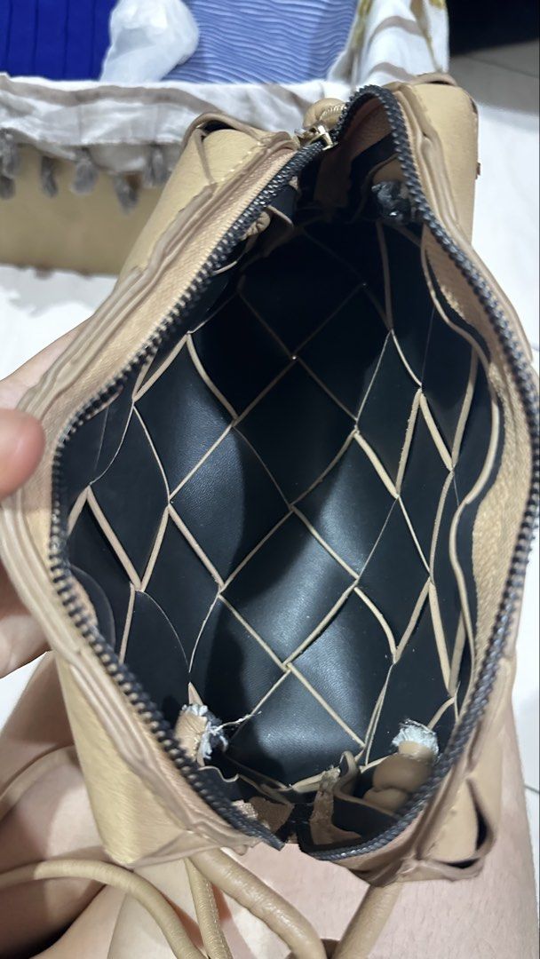Woven Parisian Crossbody Bag (Category: Cross-body Bags) located in Quezon City. Submitted by cat_0820 (Listing ID 1455813642, Image 2). Description: - Tan woven leather crossbody bag - Zipper closure - Black interior - Knotted strap detail on both sides - Ideal for everyday use - Fits your essentials.