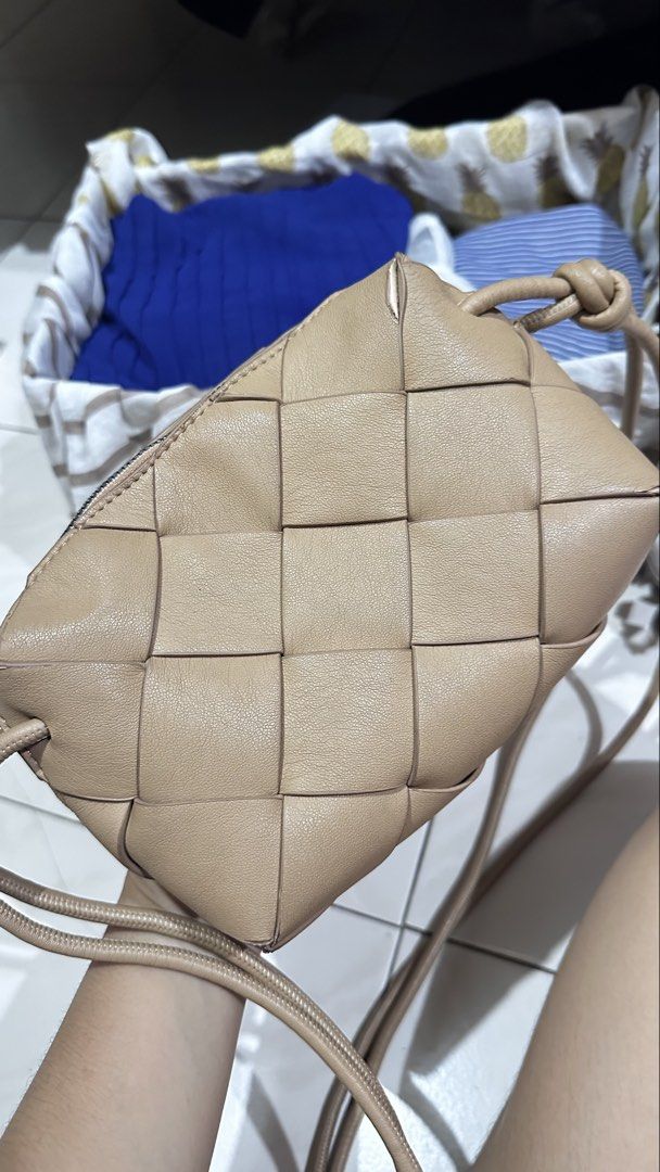 Woven Parisian Crossbody Bag (Category: Cross-body Bags) located in Quezon City. Submitted by cat_0820 (Listing ID 1455813642, Image 3). Description: - Tan woven leather crossbody bag - Zipper closure - Black interior - Knotted strap detail on both sides - Ideal for everyday use - Fits your essentials.