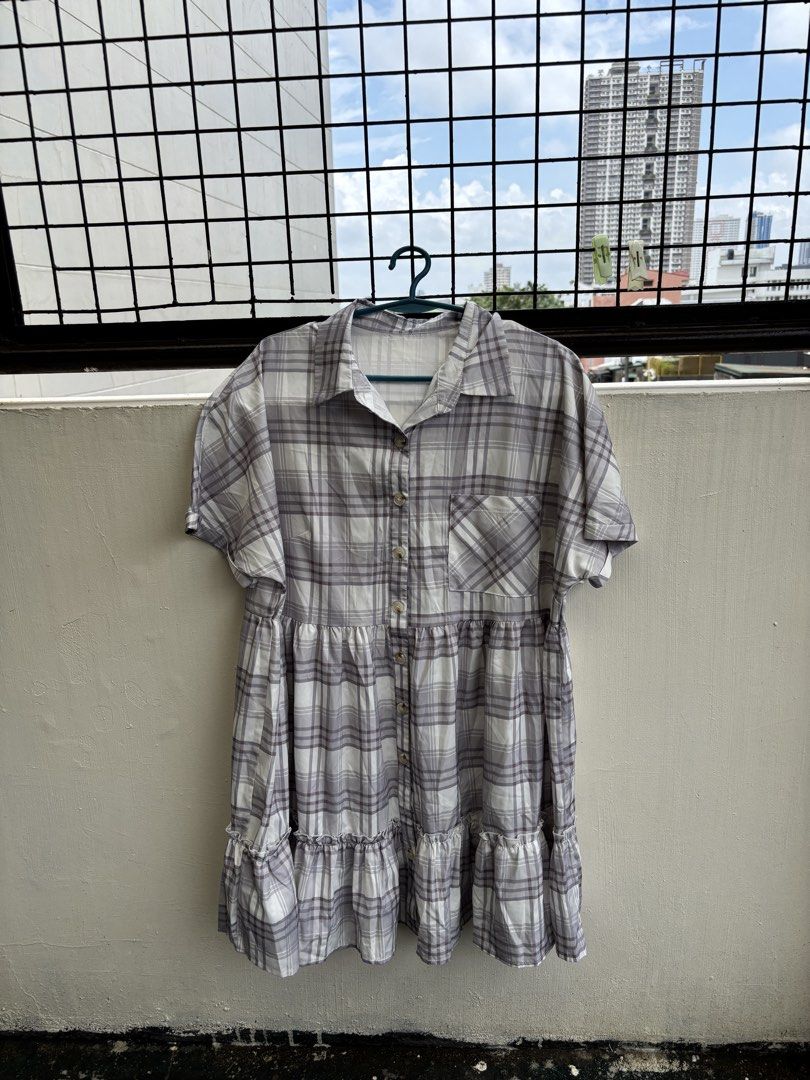 2XL Plaid Button-Up Tiered Ruffle Dress (Category: Dresses) located in Manila. Submitted by decluttergivebing (Listing ID 1455907850, Image 1). Description: - Casual plaid design - Button-up front - Short sleeves - Tiered hem with ruffles - Made from polyester and elastane blend - Ideal for everyday wear.