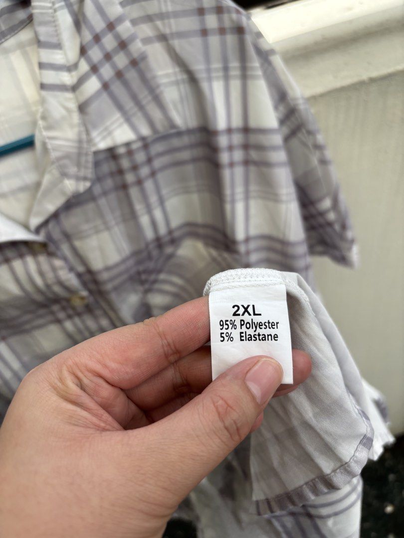 2XL Plaid Button-Up Tiered Ruffle Dress (Category: Dresses) located in Manila. Submitted by decluttergivebing (Listing ID 1455907850, Image 2). Description: - Casual plaid design - Button-up front - Short sleeves - Tiered hem with ruffles - Made from polyester and elastane blend - Ideal for everyday wear.