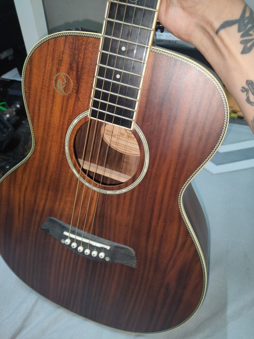 Acoustic Electric Guitar with Cutaway (Category: Musical Instruments) located in Quezon City. Submitted by dellybells03 (Listing ID 1456008996, Image 2). Description: RJ MINI ACOUSTIC GUITAR prestine condition(1month old) Acoustic guitar with beautiful wood grain and cutaway. Built-in pickup with side controls. Good for home or live performance. Ready to play! inclusions : bag and guitar itself rfs masyadong maliit.