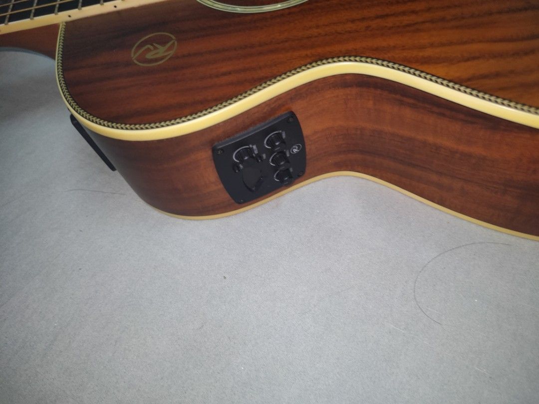 Acoustic Electric Guitar with Cutaway (Category: Musical Instruments) located in Quezon City. Submitted by dellybells03 (Listing ID 1456008996, Image 3). Description: RJ MINI ACOUSTIC GUITAR prestine condition(1month old) Acoustic guitar with beautiful wood grain and cutaway. Built-in pickup with side controls. Good for home or live performance. Ready to play! inclusions : bag and guitar itself rfs masyadong maliit.