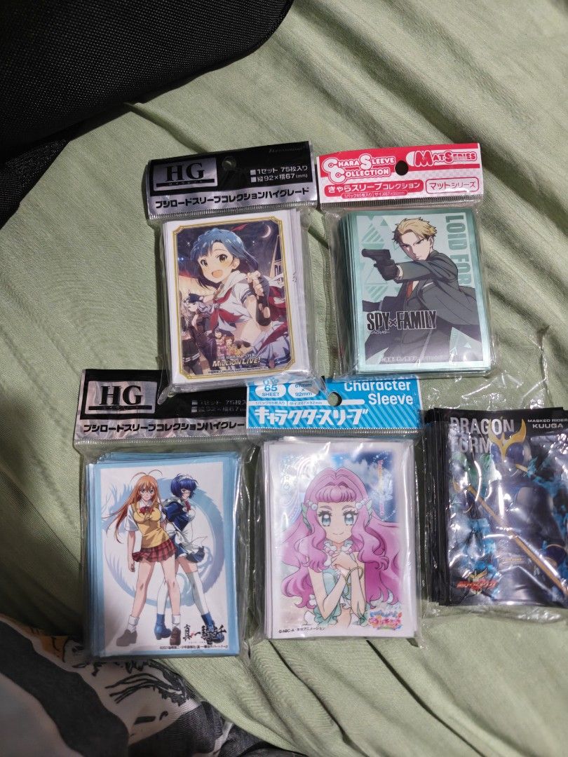 Anime Character Card Sleeves - Various Series (Category: Raw Singles) located in Caloocan City. Submitted by mackenzie001 (Listing ID 1455931124, Image 1). Description: 400 each - Protect your valuable trading card collection. - Standard size, perfect for most TCGs. - Features popular anime designs: - The Idolmaster Million Live! - Spy x Family - Dragon Drive - Other anime characters.