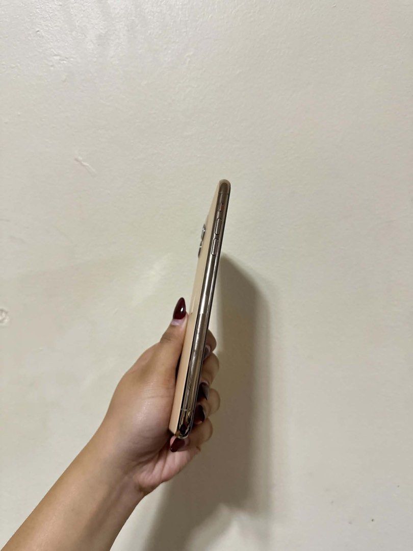 Apple iPhone 11 Pro Max Gold (Category: iPhone 11 Series) located in Manila. Submitted by rhysapollo38380 (Listing ID 1455941163, Image 1). Description: - Apple iPhone 11 Pro - Color: Gold - Globelocked (can be factory unlocked) - Features a powerful triple-camera system - Excellent display for everyday use - Ready for its next owner - No issue no dents or scratches. -Unit comes with case/cord/adaptor/ceramic tg installed/camera lens protector/ c