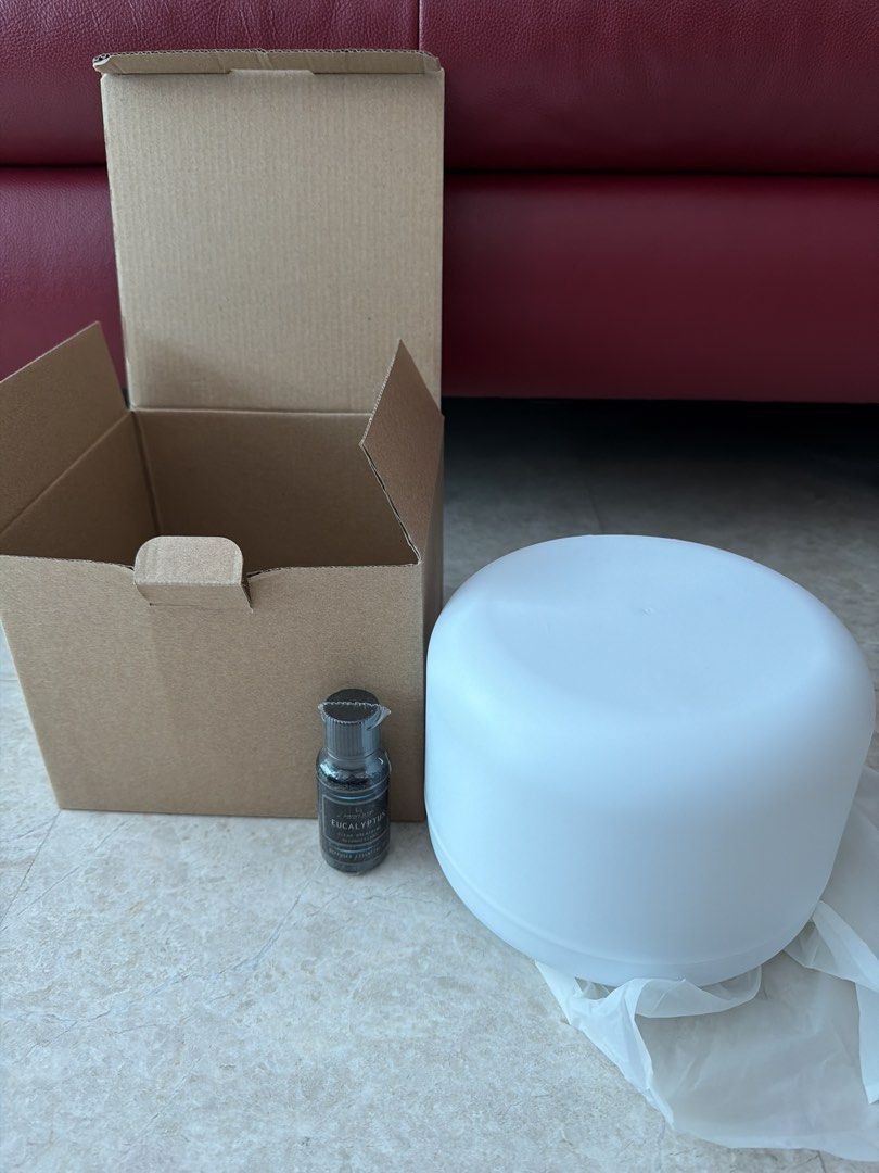 Aroma Diffuser (Category: Air Purifiers & Dehumidifiers) located in Singapore. Submitted by lynn0497 (Listing ID 1455882607, Image 1). Description: - White aroma diffuser - Includes original box and power adapter - Creates a relaxing atmosphere - Clean, modern design.