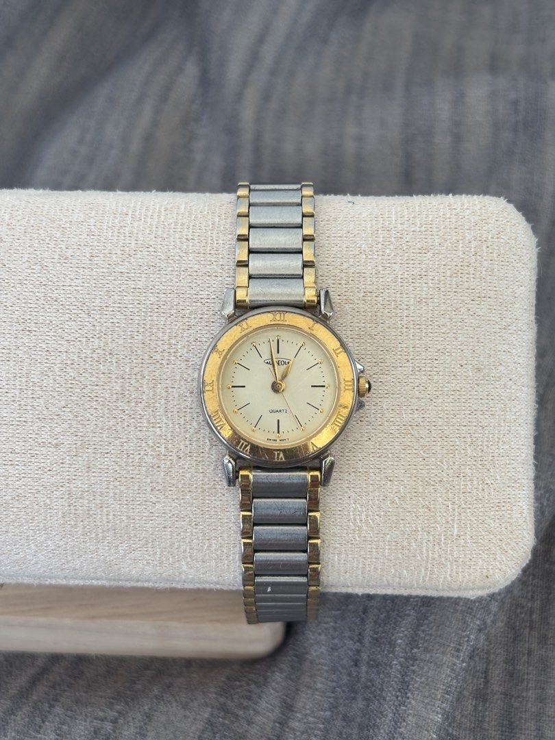 Aureole Quartz Two-Tone Watch (Category: Women's Watches) located in Puerto Princesa. Submitted by dailywristual (Listing ID 1455895183, Image 3). Description: Aureole Quartz Two-tone Watch - Two-tone metal band (Silver & Gold) - Cream dial with classic Roman numerals - Slight fadings on gold tone - 25 centavos sized dial, adjustable band for any wrist size - all original, see photos for more info - good working condition - comes with standard bo