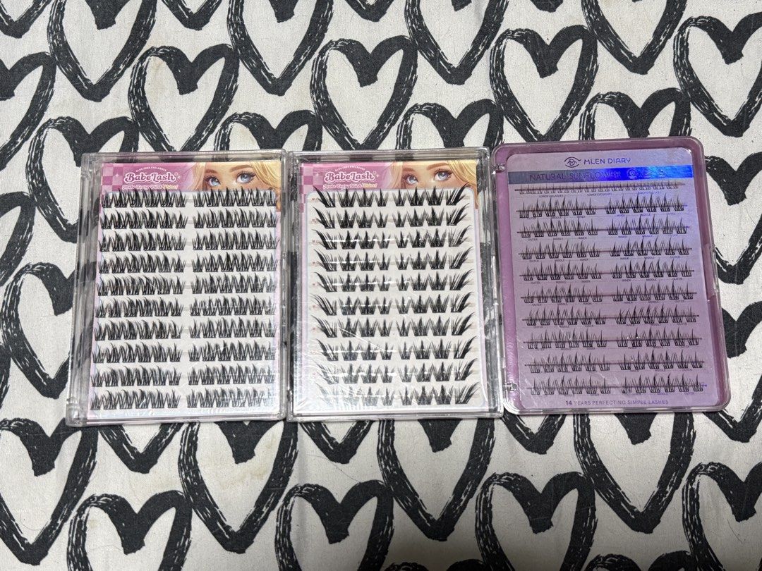 Babe Lash & MLEN DIARY Cluster Lashes (Category: Makeup) located in Manila. Submitted by gooddealsmanila (Listing ID 1456003523, Image 1). Description: - 3 packs of cluster false eyelashes included. - 2 packs are Babe Lash brand. - 1 pack is MLEN DIARY Natural Sunflower brand. - All packs are full and unused. - Perfect for adding volume and length to your lashes. - Easy to apply for a customized look, from natural to dramatic..