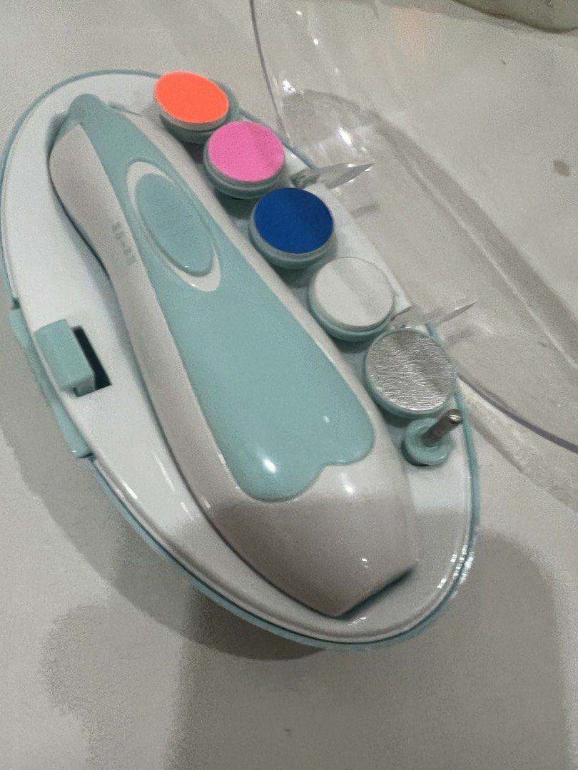 Baby Nail Trimmer Set with Multiple Heads (Category: Hands & Nails) located in Cebu City. Submitted by clothes_and_queens (Listing ID 1455907725, Image 2). Description: - Gentle electric nail trimmer designed specifically for babies. - Comes with multiple filing heads suitable for different stages of nail growth. - Ensures safe and easy nail care for your little one. - Convenient storage case included for portability and organization. - Keep your