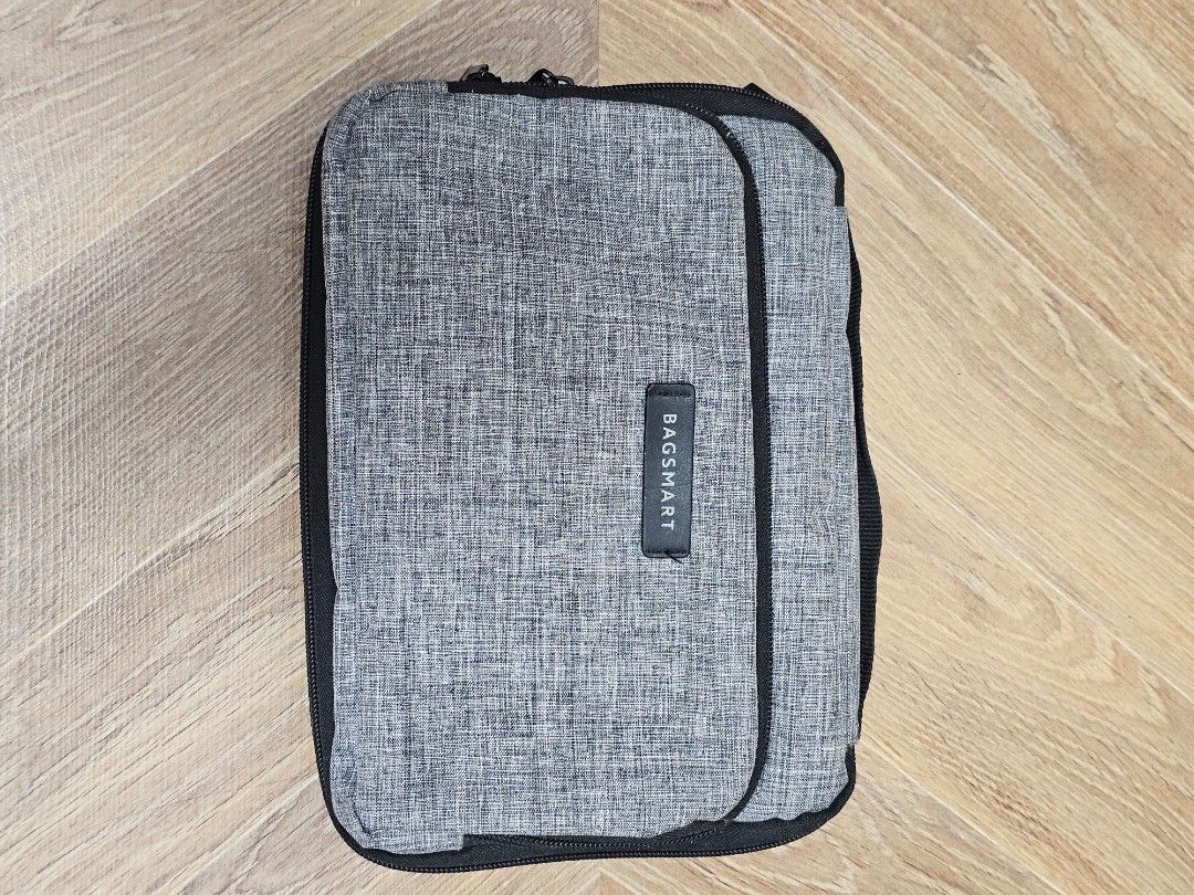 BAGSMART Grey Travel Organizer (Category: Purses & Pouches) located in Paranaque City. Submitted by rhodalietagle (Listing ID 1456023413, Image 1). Description: - Main compartment for all your essentials. - Convenient front pocket for quick access. - Secure zip closure to keep items safe. - Durable fabric construction for long-lasting use. - Designed for easy packing and effortless carrying..