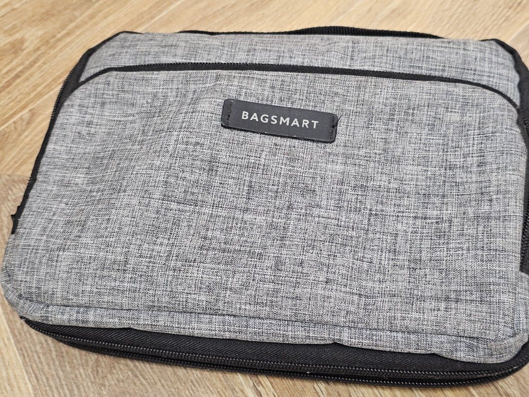 BAGSMART Grey Travel Organizer (Category: Purses & Pouches) located in Paranaque City. Submitted by rhodalietagle (Listing ID 1456023413, Image 3). Description: - Main compartment for all your essentials. - Convenient front pocket for quick access. - Secure zip closure to keep items safe. - Durable fabric construction for long-lasting use. - Designed for easy packing and effortless carrying..