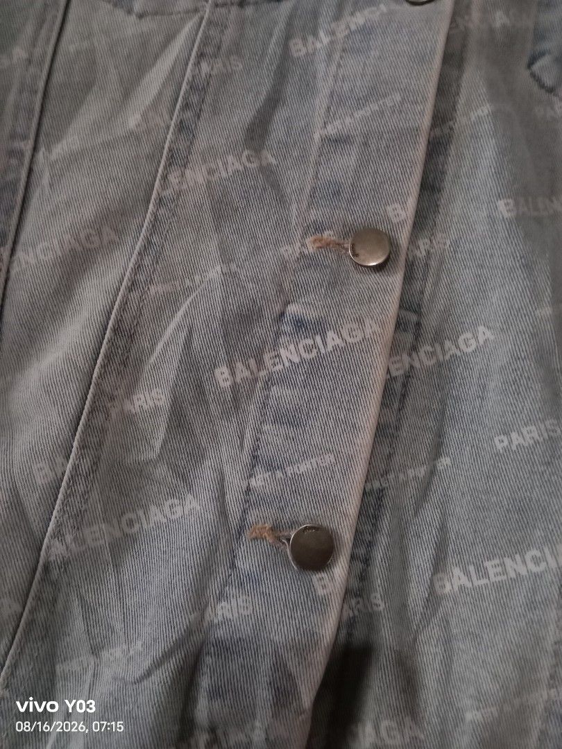 Balenciaga All Over Logo Denim Jacket (Category: Coats, Jackets and Outerwear) located in Cabuyao City. Submitted by blake657 (Listing ID 1455855070, Image 2). Description: - Light wash denim jacket - All-over Balenciaga logo print - Classic trucker style - Button front closure - Two front flap chest pockets - Button cuffs - Oversized fit, likely fits Medium to Large - Bold statement piece for any outfit no tag's po sya.