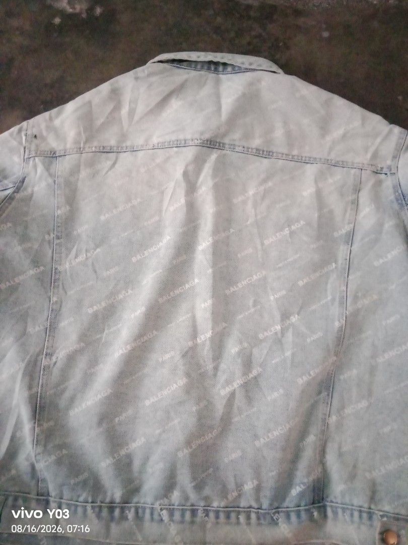 Balenciaga All Over Logo Denim Jacket (Category: Coats, Jackets and Outerwear) located in Cabuyao City. Submitted by blake657 (Listing ID 1455855070, Image 3). Description: - Light wash denim jacket - All-over Balenciaga logo print - Classic trucker style - Button front closure - Two front flap chest pockets - Button cuffs - Oversized fit, likely fits Medium to Large - Bold statement piece for any outfit no tag's po sya.