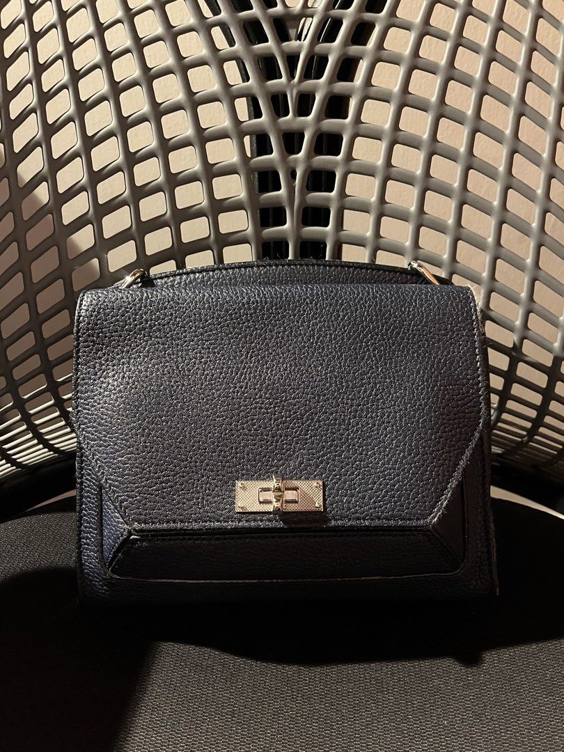 Bally Suzy (Category: Luxury Bags & Wallets) located in Quezon City. Submitted by abellana_x (Listing ID 1455978093, Image 1). Description: For sale: Bally Suzy - small Barely used, comes with dust bag. - Exterior navy blue grain leather - Interior in emerald green suede - lost the chain, used as a clutch hehe - Silver hardware - Unique B-Turn closure - Folding opening - Back pocket - Interior sliding pocket .