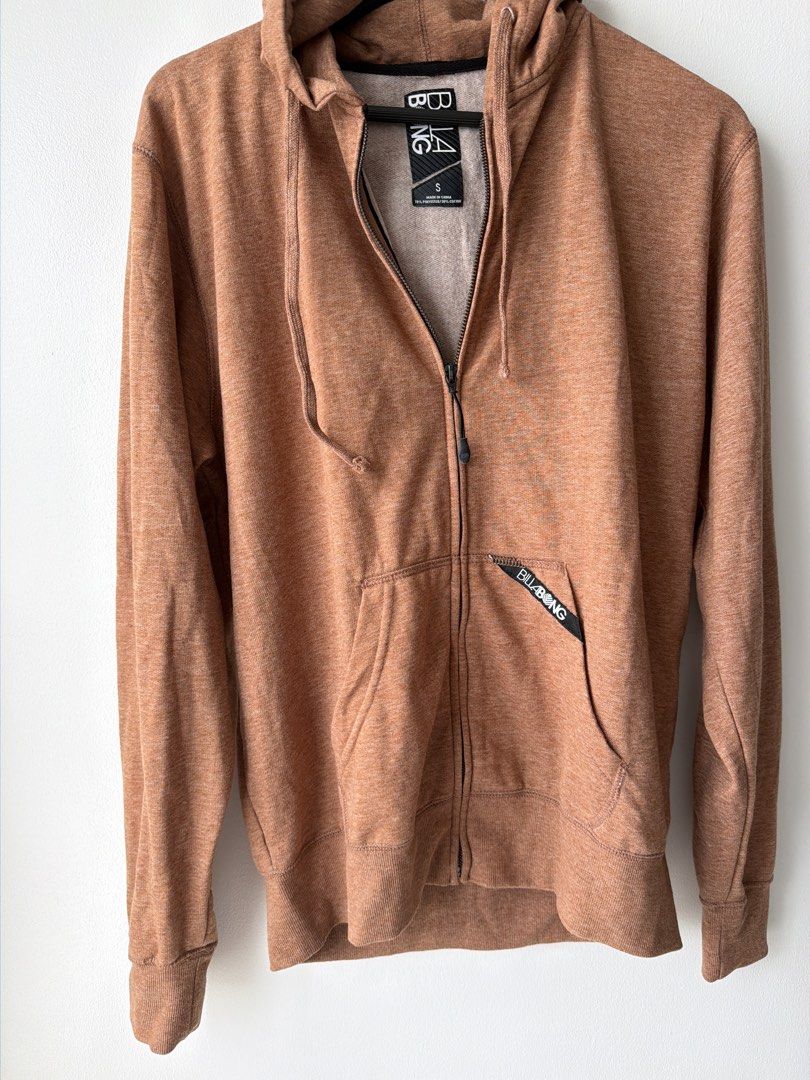 Billabong Zip-Up Hoodie Size S (Category: Coats, Jackets and Outerwear) located in Makati City. Submitted by cheapipie (Listing ID 1455901723, Image 2). Description: - BNWOT Brown heathered Billabong zip-up hoodie - Material: 70% Polyester, 30% Cotton (check label for details) - Features: Front zip closure, two front pockets, drawstring hood - Ideal for: Casual wear.