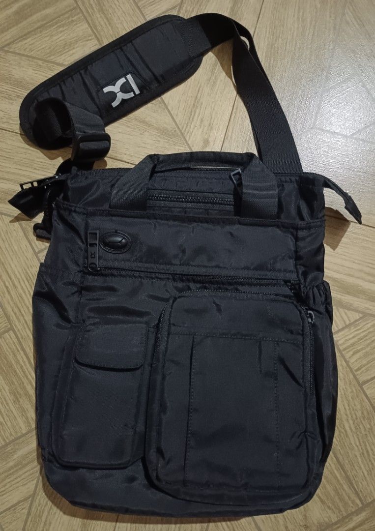 Black bag multi pocket (Category: Luxury Bags & Wallets) located in Dipolog. Submitted by snegrej10 (Listing ID 1455893388, Image 1). Description: - Stylish black messenger bag - Multiple pockets for organization (main compartment + front pockets) - Adjustable shoulder strap for comfort NO ISSUE LIKE NEW. QUALITY - Unique IXI logo zipper pull - Made with durable material - Perfect for everyday use or travel.