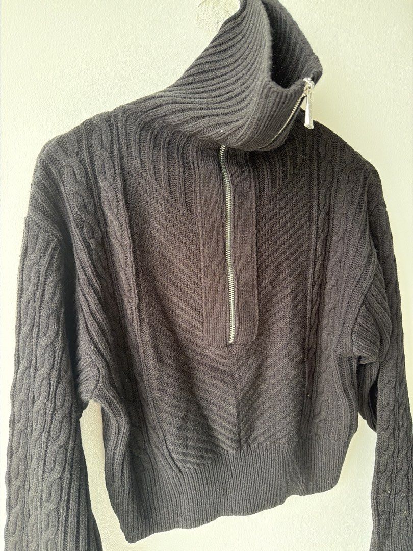 Black Cable Knit Quarter Zip Mock Neck Cropped Sweater (Category: Others Tops) located in Makati City. Submitted by cheapipie (Listing ID 1455895690, Image 2). Description: - Black cropped sweater/ can be worn multiple ways. Check pic. - Mock neck with quarter zip - Mix of cable knit and chevron patterns please check the pattern on pics - Ribbed cuffs and hem - Estimated size: Small to Medium - Versatile for layering or standalone wear -BNWOT dee