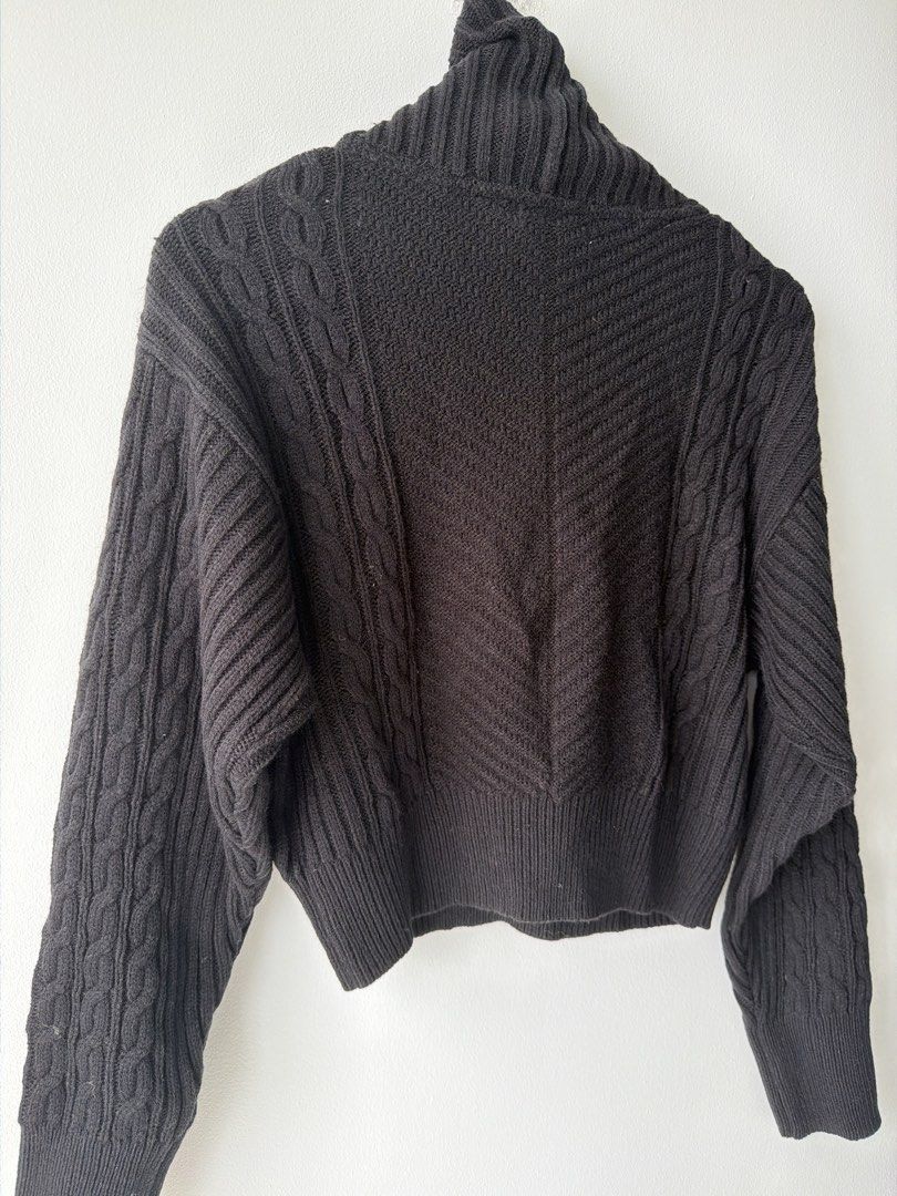 Black Cable Knit Quarter Zip Mock Neck Cropped Sweater (Category: Others Tops) located in Makati City. Submitted by cheapipie (Listing ID 1455895690, Image 3). Description: - Black cropped sweater/ can be worn multiple ways. Check pic. - Mock neck with quarter zip - Mix of cable knit and chevron patterns please check the pattern on pics - Ribbed cuffs and hem - Estimated size: Small to Medium - Versatile for layering or standalone wear -BNWOT dee