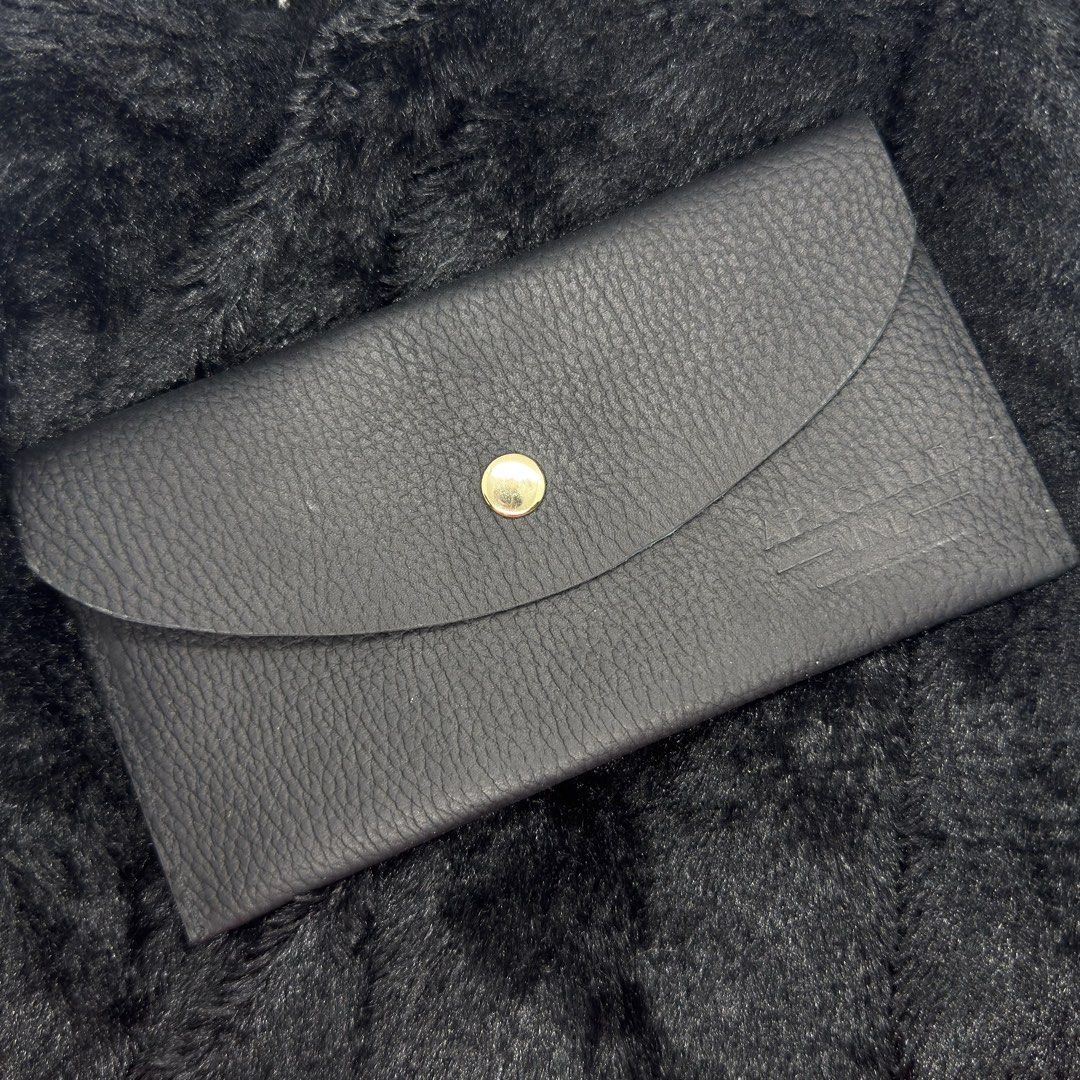 Black Leather Pouch with Gold Button (Category: Purses & Pouches) located in Kalibo. Submitted by prelovednotunloved.ph (Listing ID 1456027095, Image 1). Description: - Classic black leather pouch - Textured finish - Gold button closure on front flap - Embossed logo on the right side - Simple and elegant design - Ideal for organizing small items -Genuine Leather.