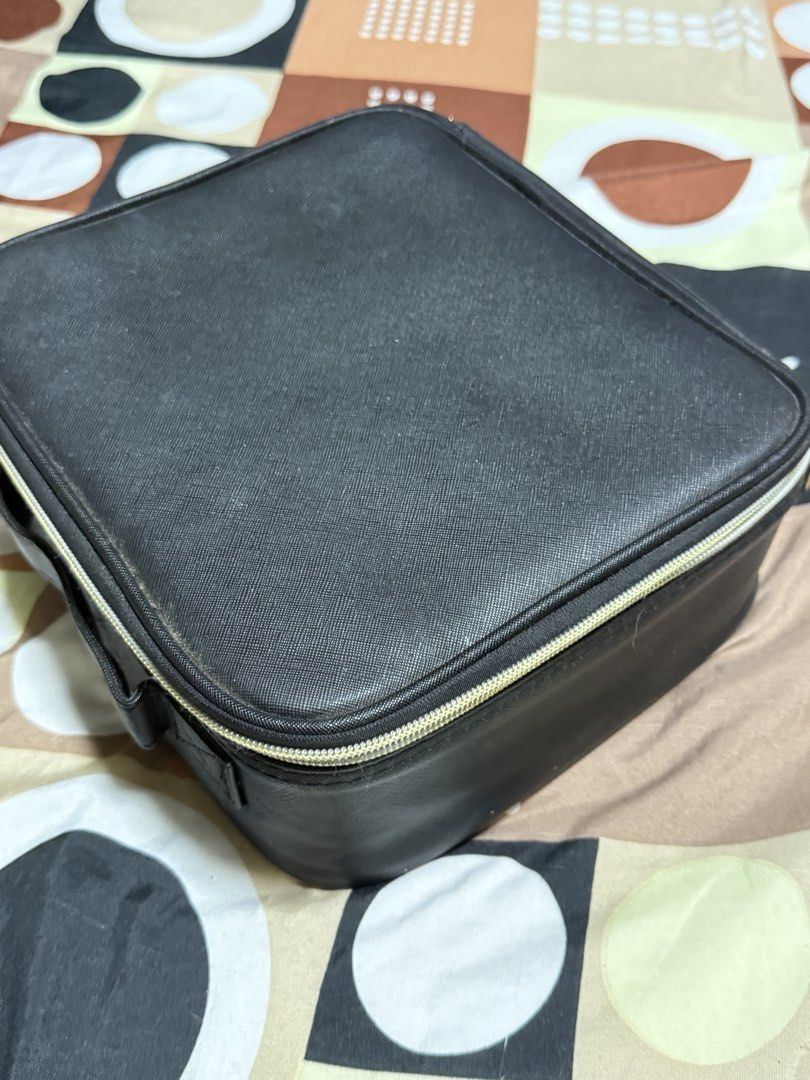 Black Makeup Train Case with Dividers (Category: Makeup) located in Manila. Submitted by gooddealsmanila (Listing ID 1456004164, Image 2). Description: - Chic black makeup case with elegant gold zipper. - Customizable interior with adjustable dividers for perfect organization. - Lid features elastic straps to secure your essentials. - Ideal for both travel and home storage. - Convenient front handle for easy portability..