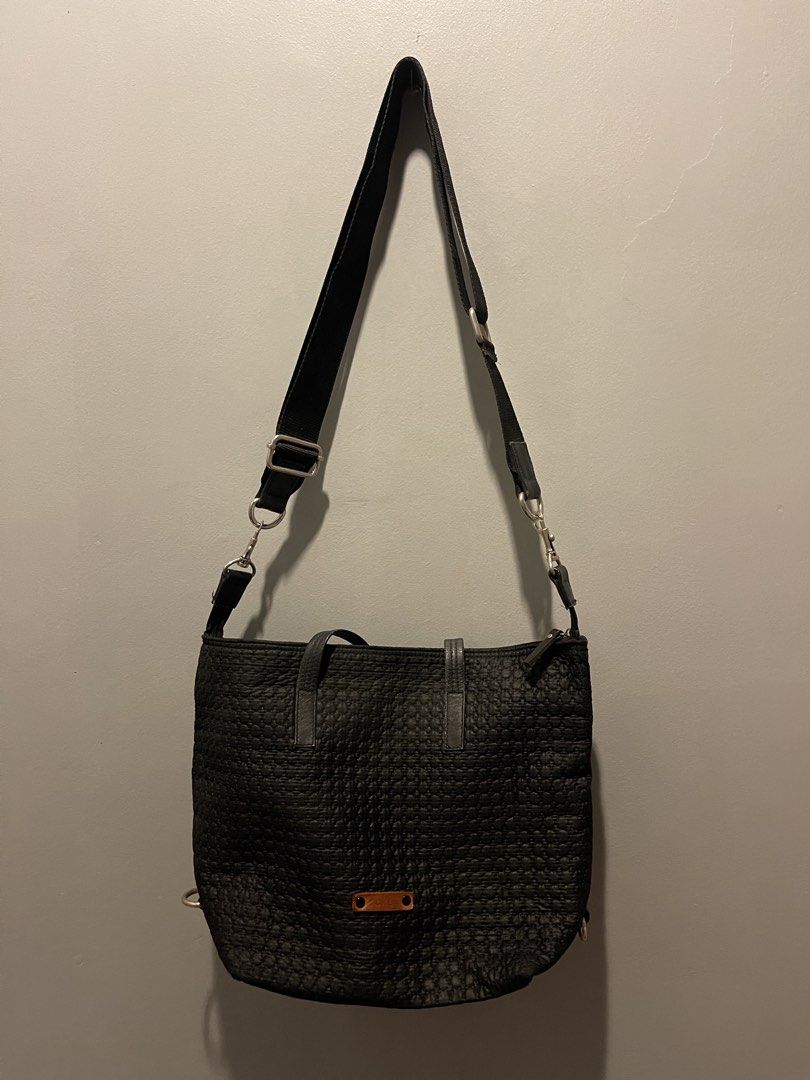 Black Textured Tote Bag with Adjustable Strap (Category: Tote Bags) located in Muntinlupa City. Submitted by cheeeeky (Listing ID 1455973853, Image 1). Description: - Stylish black tote bag with a unique textured pattern. - Main compartment for ample storage. - Detachable and adjustable shoulder strap for versatile carrying. - Features an embossed ‘CRL' leather tag on the front. - Ideal for everyday use..