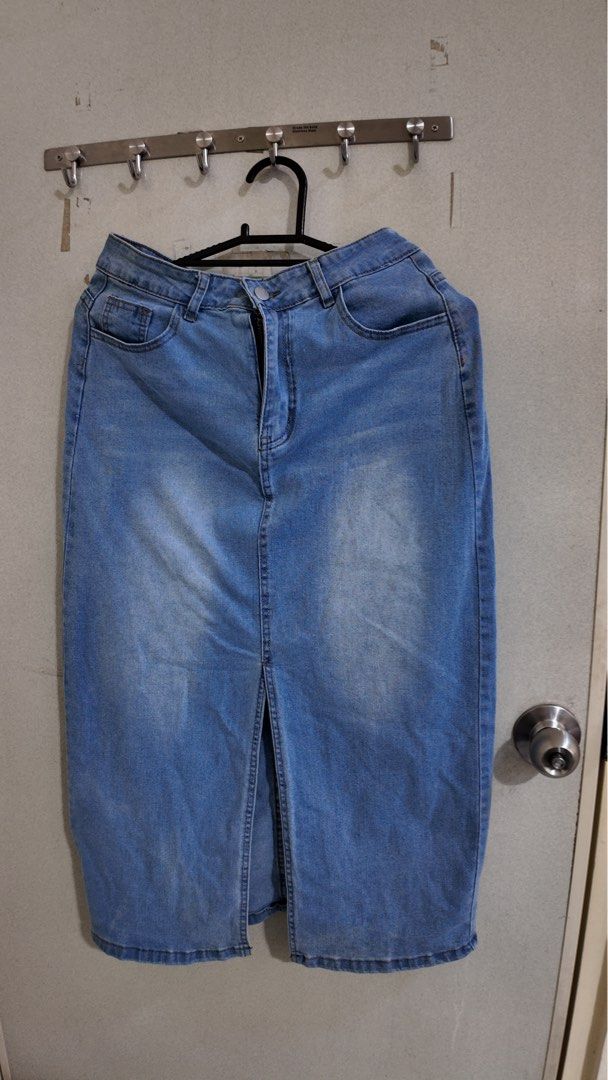Blue Denim Midi Skirt with Front Slit (Category: Skirts) located in Malabon City. Submitted by jhensengo (Listing ID 1456015841, Image 1). Description: - Classic blue denim midi skirt - Front slit for easy movement - Two back pockets and two front pockets - Button and zip closure - Versatile for casual outfits - Pairs well with tops and sneakers.