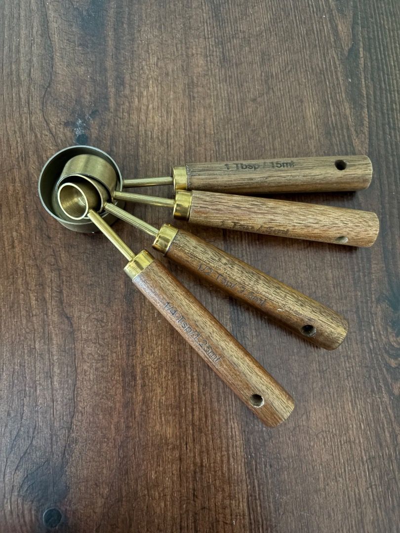 Brass measuring cups and spoons (Category: Other Kitchenware & Tableware) located in Quezon City. Submitted by mariane_1963 (Listing ID 1455892443, Image 3). Description: - Hardly used set of measuring cups and spoons - Made with brass and elegant wooden handles - Perfect for baking and cooking - Adds a touch of style to your kitchen counter - Bought the set for ~₱1200 from an IG store - Rfs: decluttering - Last price posted; no more haggling and