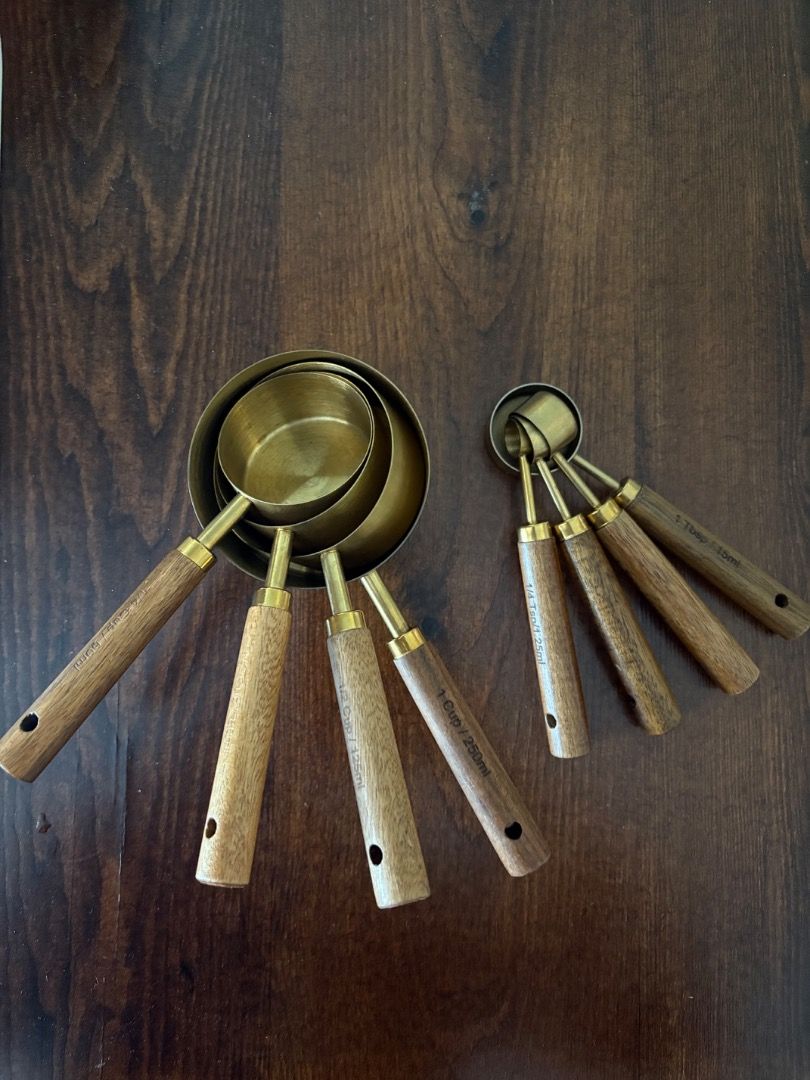 Brass measuring cups and spoons (Category: Other Kitchenware & Tableware) located in Quezon City. Submitted by mariane_1963 (Listing ID 1455892443, Image 1). Description: - Hardly used set of measuring cups and spoons - Made with brass and elegant wooden handles - Perfect for baking and cooking - Adds a touch of style to your kitchen counter - Bought the set for ~₱1200 from an IG store - Rfs: decluttering - Last price posted; no more haggling and