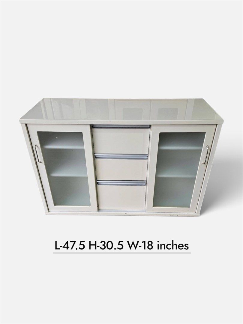 Buffet Cabinet (Duco)‼️ (Category: Shelves, Cabinets & Racks) located in Quezon City. Submitted by ledamadel (Listing ID 1455864115, Image 1). Description: Buffet Cabinet (Duco)‼️₱8,800‼️ ✔️L-47.5 H-30.5 W-18 inches 📐 ✔2 Sliding, 3 Drawers 🗄 ✔️Laminated 🔖 ✔️Compress & Mdf Back 🪵 ✔Scratches As-is! 👌 Location: 40 Aplaya St Napocor Vill. Tandang Sora Quezon City. For inquiry please Pm us or Call. 09066885859 Please like our page thanks! 👇👇👇�