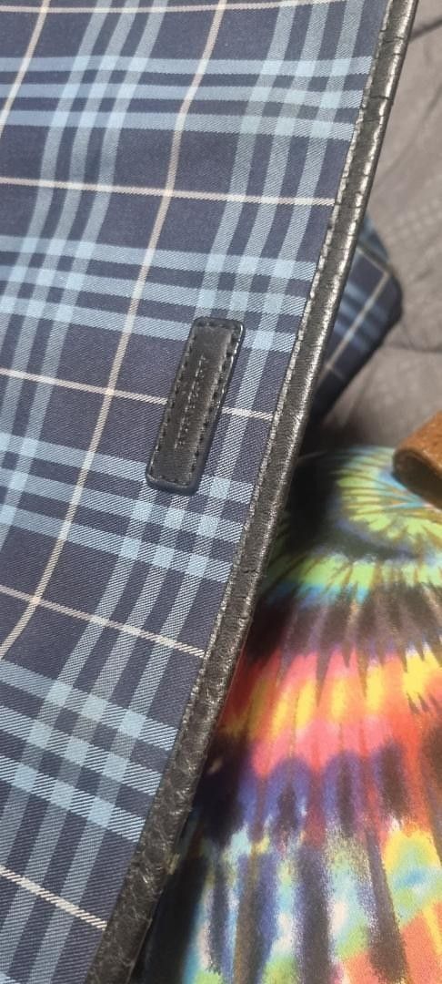 Burberry Blue Nova Check Messenger Bag (Category: Luxury Bags & Wallets) located in Mandaluyong City. Submitted by Lucky3CsMom (Listing ID 1455880569, Image 2). Description: - Classic Burberry messenger/laptop bag -authentic.(money back guarantee - Iconic blue Nova Check pattern - Leather trim and details - Secure magnetic snap closure - Perfect for everyday use or travel - Shows minor signs of wear on snap closure and corners.