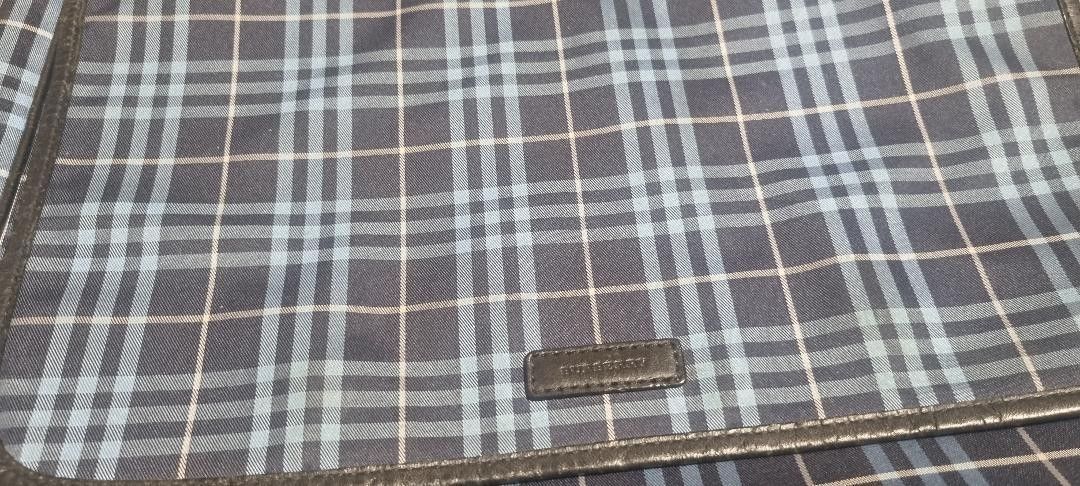 Burberry Blue Nova Check Messenger Bag (Category: Luxury Bags & Wallets) located in Mandaluyong City. Submitted by Lucky3CsMom (Listing ID 1455880569, Image 3). Description: - Classic Burberry messenger/laptop bag -authentic.(money back guarantee - Iconic blue Nova Check pattern - Leather trim and details - Secure magnetic snap closure - Perfect for everyday use or travel - Shows minor signs of wear on snap closure and corners.