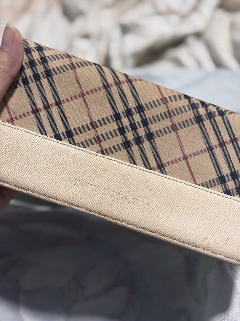 Burberry Nova Check Leather Long Wallet (Category: Luxury Bags & Wallets) located in Cavite. Submitted by _rand0mstuff4u (Listing ID 1455939177, Image 1). Description: - Classic Burberry Nova Check Leather wallet - Beige and red plaid pattern with cream leather trim - Multiple card slots and compartments - Secure snap closure - RFS: need funds Negotiable just pm me.