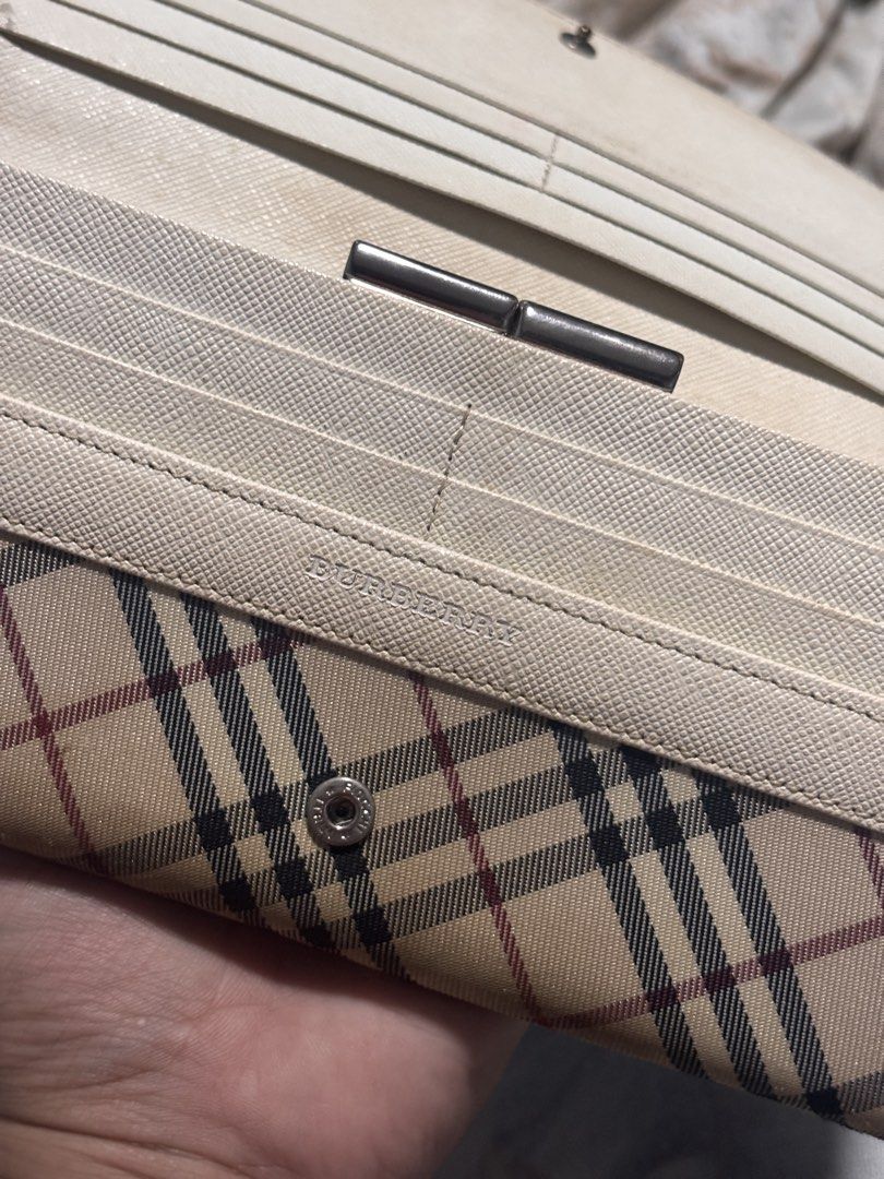 Burberry Nova Check Leather Long Wallet (Category: Luxury Bags & Wallets) located in Cavite. Submitted by _rand0mstuff4u (Listing ID 1455939177, Image 3). Description: - Classic Burberry Nova Check Leather wallet - Beige and red plaid pattern with cream leather trim - Multiple card slots and compartments - Secure snap closure - RFS: need funds Negotiable just pm me.