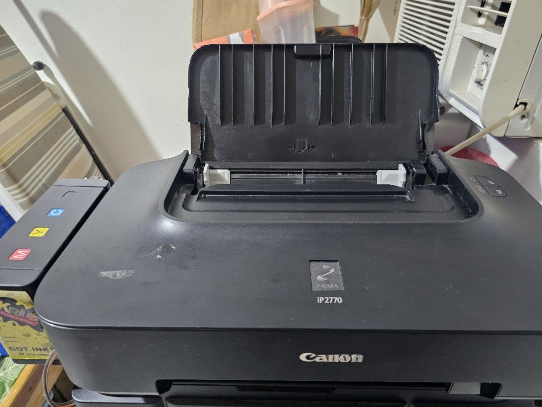 Canon PIXMA IP2770 Printer (Category: Printers, Scanners & Copiers) located in Cainta. Submitted by ej_emuslan (Listing ID 1455907613, Image 2). Description: - Canon PIXMA IP2770 printer with Lifetime Warranty with Inkrite - Color: Black - Includes power cord - Top lid opens to ink cartridge area - Some ink cartridges attached - Tested and working - Ideal for home or office use.