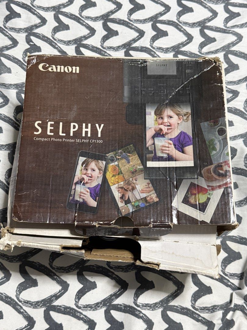 Canon SELPHY CP1300 Compact Photo Printer WiFi (Category: Printers, Scanners & Copiers) located in Manila. Submitted by gooddealsmanila (Listing ID 1456003404, Image 3). Description: - Canon SELPHY CP1300 compact photo printer - Easy WiFi connectivity - Includes power adapter and some accessories.