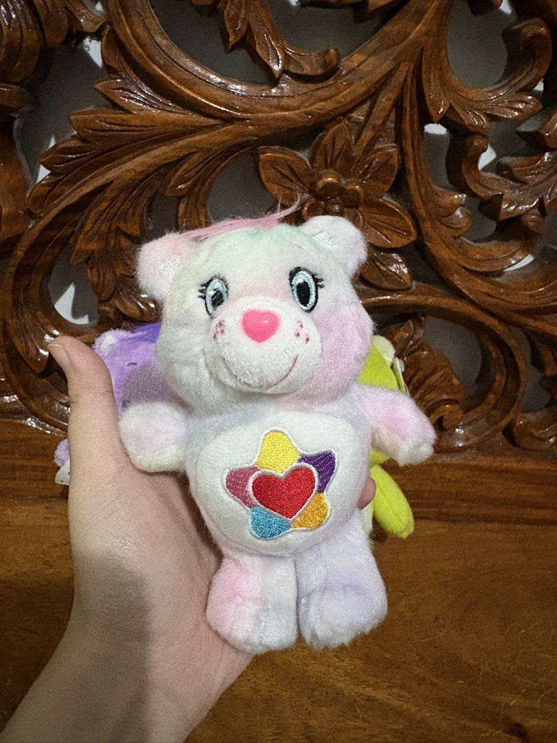 Care Bears Plush Toys (Category: Plushies & Soft Toys) located in Quezon City. Submitted by rxyel (Listing ID 1455894753, Image 2). Description: - Set of 4 adorable Care Bears plush toys. - Includes: Large pink bear with rainbow belly, green bear with kite, purple bear with bow, and a small charm bear with a heart. - Ideal for collectors or as a thoughtful gift. 1: 200 2: 300 3: 300 4: 380 .