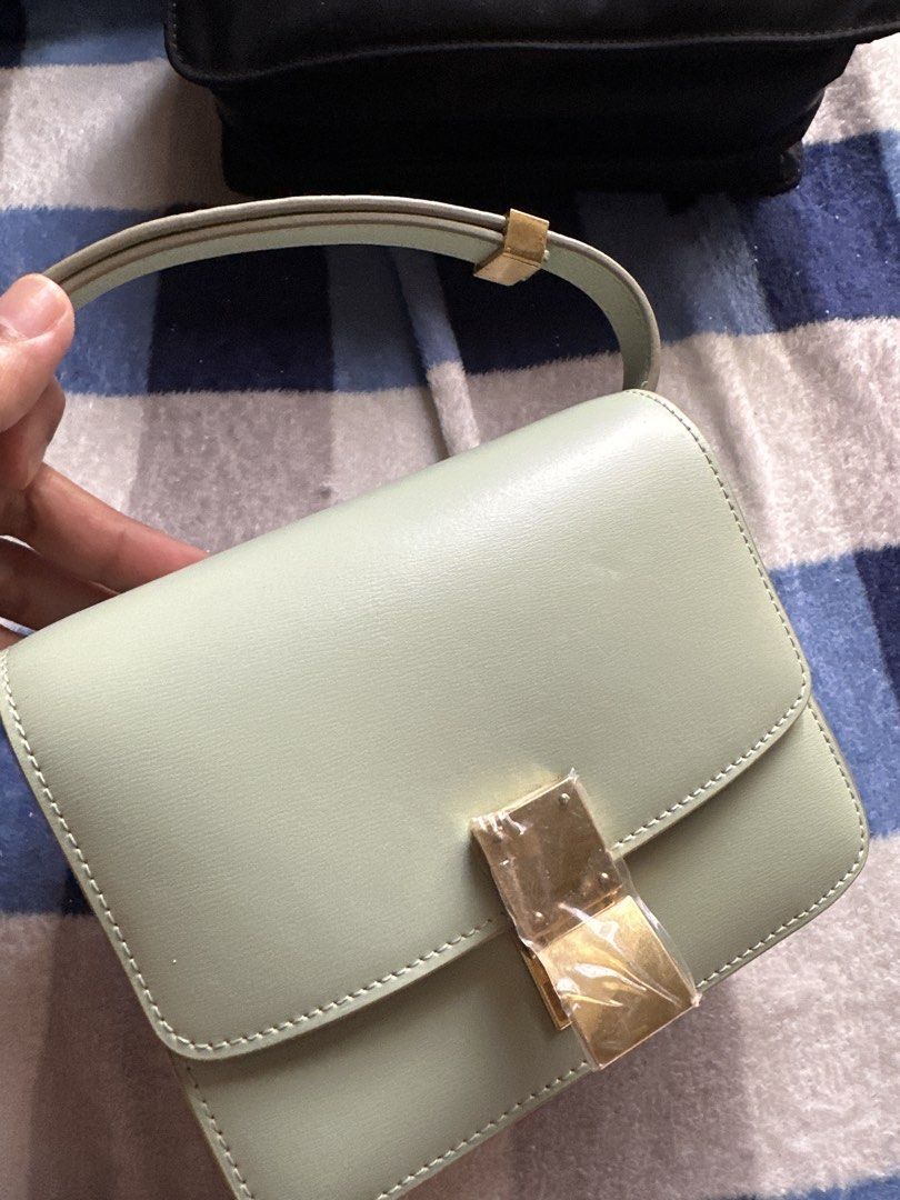 Celine Paris Light Green Leather Shoulder Bag (Category: Luxury Bags & Wallets) located in Pasig City. Submitted by the_bag_agent (Listing ID 1455857040, Image 1). Description: - Light green NGA Celine Paris shoulder bag - Genuine leather material - Elegant gold hardware clasp - Multiple interior compartments for organization - Adjustable strap for comfortable wear - clean inside and out - Versatile for daily use or special events.
