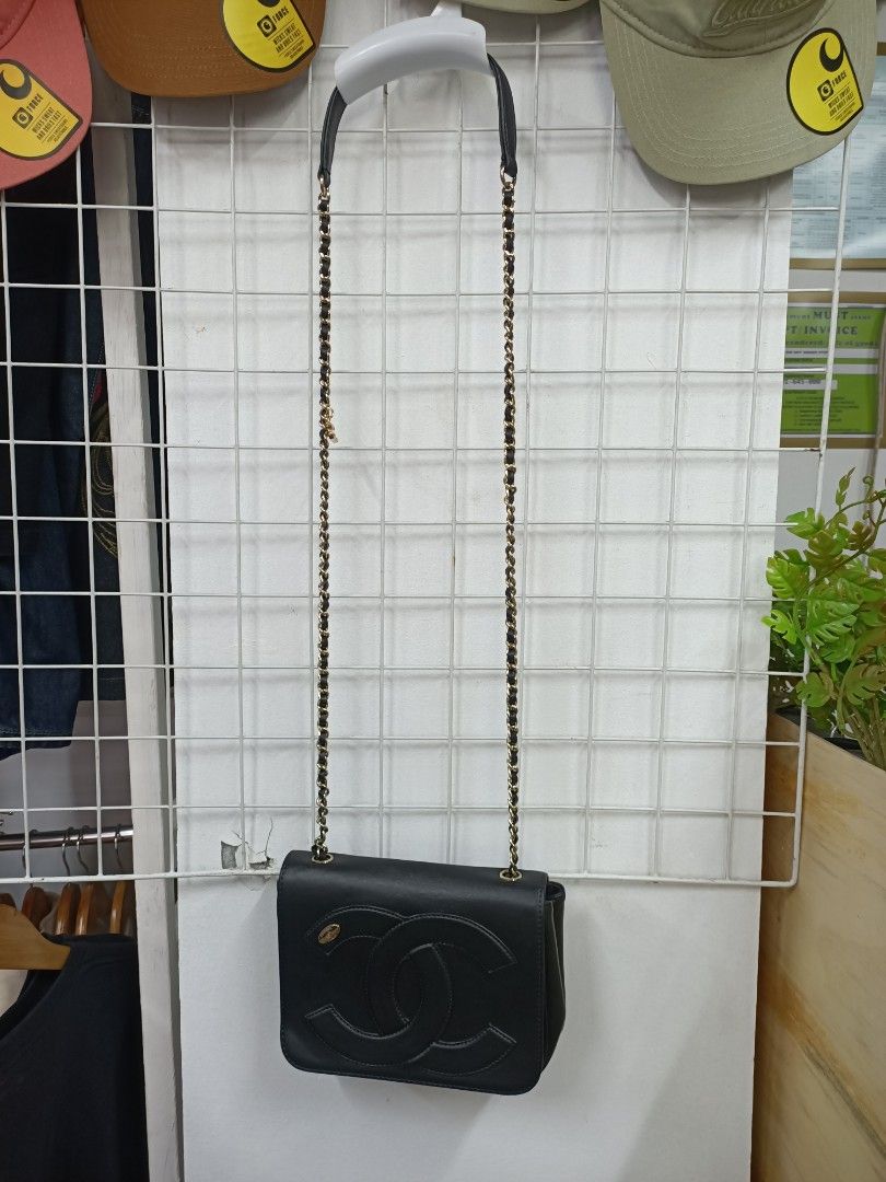 Chanel Black Leather Flap Bag with Chain Strap (Category: Luxury Bags & Wallets) located in Bayombong. Submitted by rheaaa00530 (Listing ID 1455993687, Image 1). Description: - Classic black Chanel flap bag - Iconic CC logo on the front - Gold-tone chain strap with leather detailing - Ideal for evenings or adding luxury to any outfit - Clean interior - A timeless piece for your collection - Issue: Recolor.