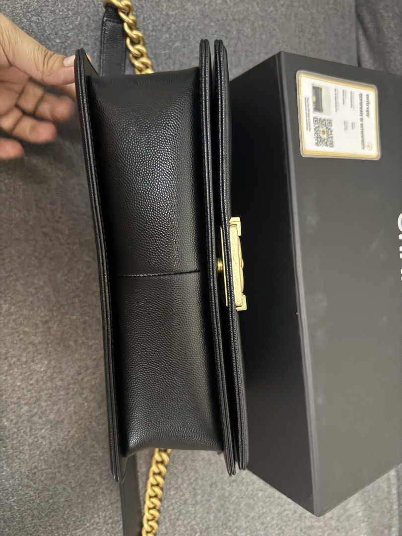 Chanel Boy Bag Black Caviar Gold Hardware (Category: Luxury Bags & Wallets) located in Mandaluyong City. Submitted by fhenvinco (Listing ID 1455873255, Image 2). Description: - Authentic Chanel Boy Bag - Material: Black Caviar Leather - Hardware: Gold - Includes: Original Box, Dust Bag, Certificate of Authenticity - Design: Classic Quilted - Strap: Chain Strap - Versatile: Perfect for day or night use Hologram.