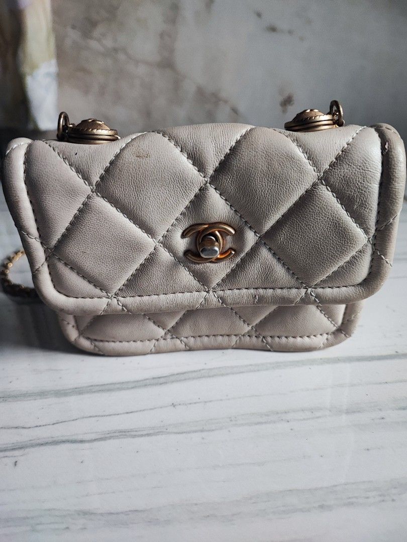 Chanel Quilted Chain Bag White (Category: Luxury Accessories) located in Tarlac. Submitted by venuslim1624398 (Listing ID 1455887727, Image 3). Description: - Preloved from Japan - White quilted mini bag - Classic Chanel-inspired style - Compact size, ideal for essentials - Features gold hardware.