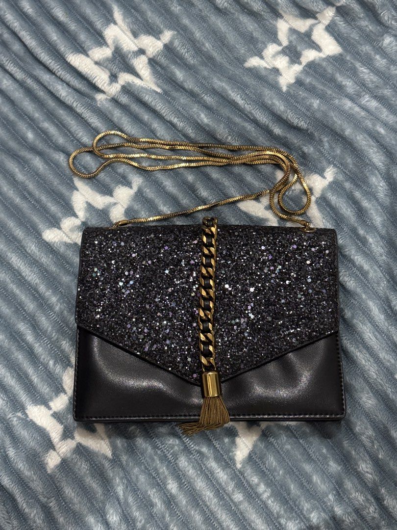Charles & Keith Black Glitter Chain Strap Clutch Bag (Category: Clutches) located in Manila. Submitted by chowpade (Listing ID 1455973907, Image 1). Description: Hardware: Minor tarnish sa magnetic snap button (does not affect functionality; snaps securely shut). Overall body and glitter are clean and good condition .
