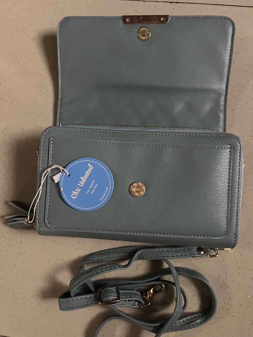 Chic Unlimited Quilted Wallet Purse with Strap (Category: Wallets & Card holders) located in Angeles City. Submitted by safe.simpledesign (Listing ID 1455932394, Image 3). Description: - Chic light blue quilted wallet purse - Features a secure zip compartment - Multiple card slots for organization - Includes a convenient detachable strap - Elegant gold hardware details - Brand new with tag still attached - Generous size: approximately 8 inches wi